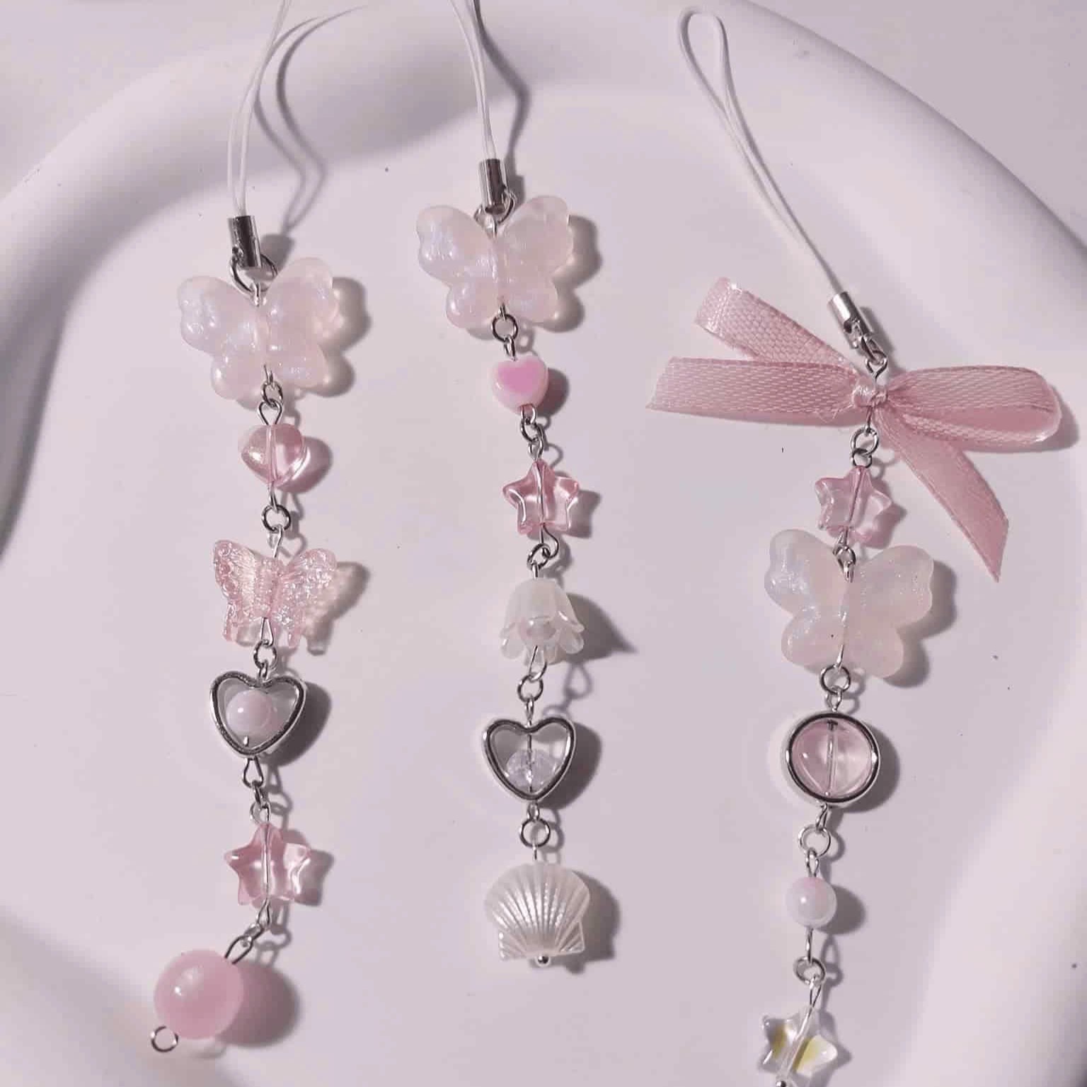 DÂY TREO ĐIỆN THOẠI TONE HỒNG TRẮNG - 6 CHARM