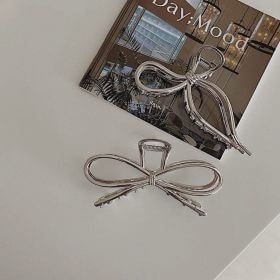 Kẹp ngang kim loại hình nơ